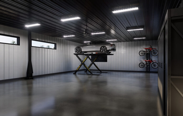 inside of a garage with a car hoisted