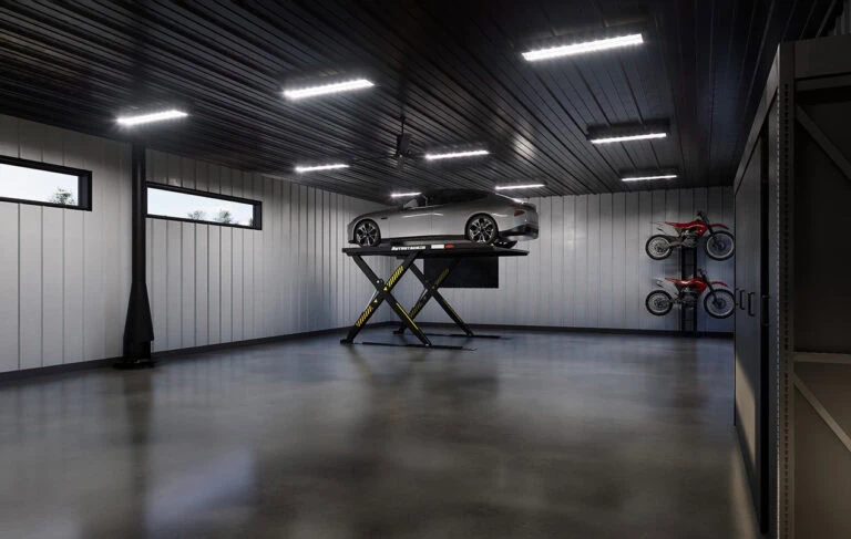 inside of a garage with a car hoisted